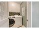 Practical laundry room equipped with a washer, dryer, and ample storage space at 1134 Shadow Lake Cir # 55, Mount Pleasant, SC 29464