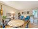 Bright living room featuring a round table and hardwood floors with an assortment of decor and accent furniture at 1134 Shadow Lake Cir # 55, Mount Pleasant, SC 29464