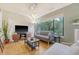 Cozy living room with hardwood floors, a large window, and modern furnishings creating a comfortable atmosphere at 1134 Shadow Lake Cir # 55, Mount Pleasant, SC 29464