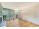 Living room with hardwood floors and view to deck with lush backyard at 1134 Shadow Lake Cir # 55, Mount Pleasant, SC 29464
