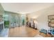 Living room with hardwood floors, fireplace, and view to deck with mature landscaping at 1134 Shadow Lake Cir # 55, Mount Pleasant, SC 29464