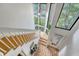 Bright staircase with ample natural light from large windows overlooking the front yard at 1134 Shadow Lake Cir # 55, Mount Pleasant, SC 29464