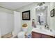 Light and airy bathroom featuring a shower-tub combination, vanity, and an artistic decor at 118 Congress St # F, Charleston, SC 29403