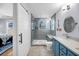 Stylishly renovated bathroom featuring a glass enclosed shower, blue vanity, and modern fixtures at 118 Congress St # F, Charleston, SC 29403