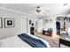 Spacious bedroom featuring multiple closets, a ceiling fan, and light-filled interior at 118 Congress St # F, Charleston, SC 29403
