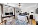 Inviting bedroom featuring a workspace, ceiling fan and a cozy interior at 118 Congress St # F, Charleston, SC 29403