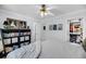 Bright bedroom featuring a ceiling fan, walk-in closet and light walls at 118 Congress St # F, Charleston, SC 29403