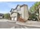 Two-story home with driveway parking, two garage spaces, and wooden staircase at 118 Congress St # F, Charleston, SC 29403