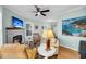 Bright living room with stone fireplace, comfortable seating, and natural light at 118 Congress St # F, Charleston, SC 29403