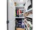 Organized walk-in closet with shelves, hanging rods, and storage solutions at 118 Congress St # F, Charleston, SC 29403