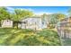 Spacious backyard featuring a chain-link fence and a charming pergola, perfect for outdoor entertaining and relaxation at 118 Regent St, Summerville, SC 29483