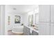Bright bathroom with a soaking tub, double vanity, and stylish modern fixtures at 118 Regent St, Summerville, SC 29483