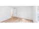 A bright bedroom with an open door and two large windows at 118 Regent St, Summerville, SC 29483