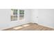 Bright bedroom featuring fresh paint, natural light, and modern flooring at 118 Regent St, Summerville, SC 29483
