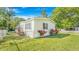 Charming home with well-maintained lawn and vibrant floral arrangements at 118 Regent St, Summerville, SC 29483