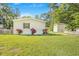 Charming home with well-maintained lawn and vibrant floral arrangements at 118 Regent St, Summerville, SC 29483