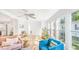 Bright living room showcasing large windows and open layout to kitchen at 118 Regent St, Summerville, SC 29483