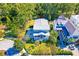 Aerial view of a charming two-story home with mature landscaping and a metal roof at 1212 Clonmel Pl, Mount Pleasant, SC 29464