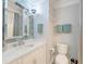 Bathroom with marble vanity, recessed lighting, and a large mirror at 1212 Clonmel Pl, Mount Pleasant, SC 29464