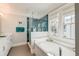 Well-lit bathroom with soaking tub, blue tiled walk-in shower, and double windows providing natural light at 1212 Clonmel Pl, Mount Pleasant, SC 29464
