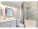 Bright bathroom with a shower/tub combo, ample storage, and a vanity with white cabinets at 1212 Clonmel Pl, Mount Pleasant, SC 29464