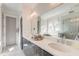 Bright bathroom featuring double sinks, quartz countertops, and a large frameless mirror at 1212 Clonmel Pl, Mount Pleasant, SC 29464