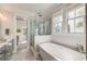 Clean bathroom features a soaking tub next to a large, glass enclosed shower at 1212 Clonmel Pl, Mount Pleasant, SC 29464