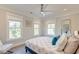 Bedroom with ample natural light from large windows, ceiling fan, and comfortable bed at 1212 Clonmel Pl, Mount Pleasant, SC 29464