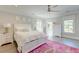 Bright bedroom featuring a white bed, dresser, and mirror on light hardwood floors at 1212 Clonmel Pl, Mount Pleasant, SC 29464