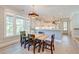 Inviting dining room featuring natural light, shiplap accents, and seamless flow to the modern, well-equipped kitchen at 1212 Clonmel Pl, Mount Pleasant, SC 29464