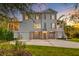 Charming two-story house with a three-car garage and patterned concrete driveway at 1212 Clonmel Pl, Mount Pleasant, SC 29464