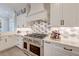 Well-appointed kitchen featuring stainless steel appliances, custom cabinetry, and a stylish backsplash at 1212 Clonmel Pl, Mount Pleasant, SC 29464