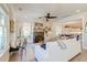 Bright living room with a stone fireplace, natural light, and an open layout, perfect for entertaining or relaxing at 1212 Clonmel Pl, Mount Pleasant, SC 29464