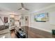 Cozy living room with hardwood floors, neutral paint and a large TV screen on the wall at 1212 Clonmel Pl, Mount Pleasant, SC 29464