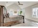 Bright main bedroom featuring a high vaulted ceiling, a ceiling fan and three windows at 1212 Clonmel Pl, Mount Pleasant, SC 29464