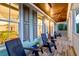 Relaxing porch with Adirondack chairs, wood flooring, and natural views at 1212 Clonmel Pl, Mount Pleasant, SC 29464