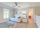 Bright sitting area featuring a white couch and blue decor on light wood floors at 1212 Clonmel Pl, Mount Pleasant, SC 29464