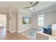 Cozy sitting room featuring a television, fan, and an area rug at 1212 Clonmel Pl, Mount Pleasant, SC 29464