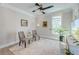 Bright sitting room with shiplap walls, natural light, and stylish decor, creating a cozy and inviting space at 1212 Clonmel Pl, Mount Pleasant, SC 29464