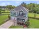 Gorgeous aerial view of a two story home with a well-maintained lawn and a fenced backyard, creating a private oasis at 123 Mcdonald Ct, Summerville, SC 29485