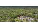 A high-angle aerial shot showcases a home in a tree-lined neighborhood at 123 Mcdonald Ct, Summerville, SC 29485