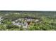 Aerial view showcasing the home's location within a wooded community with a pond at 123 Mcdonald Ct, Summerville, SC 29485