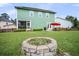 Lush backyard featuring a fire pit area, patio, and ample green space, ideal for entertaining at 123 Mcdonald Ct, Summerville, SC 29485