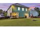 Backyard featuring a patio, grill, fire pit, and a well-maintained lawn, ideal for outdoor living and entertaining at 123 Mcdonald Ct, Summerville, SC 29485