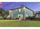 Charming backyard with green lawn, a patio seating area, and partial fence with a privacy screen at 123 Mcdonald Ct, Summerville, SC 29485