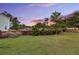 Expansive backyard featuring lush green grass, a wooden fence, and mature trees, offering privacy and a natural setting at 123 Mcdonald Ct, Summerville, SC 29485
