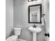 Charming powder room features a pedestal sink, stylish mirror, and neutral wall color at 123 Mcdonald Ct, Summerville, SC 29485