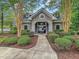 Charming clubhouse entrance with manicured landscaping and a welcoming walkway at 123 Mcdonald Ct, Summerville, SC 29485