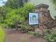 The Bluffs At Ashley River community sign amidst lush landscaping, signaling a welcoming entrance at 123 Mcdonald Ct, Summerville, SC 29485