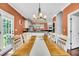 Bright dining room with a large table, stylish chandelier, and views of the kitchen, perfect for Gathering meals and dinner parties at 123 Mcdonald Ct, Summerville, SC 29485